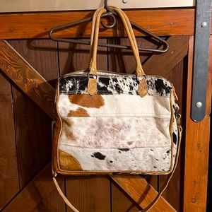 Cowhide purse is also fit your laptop will really nice and cute u will love it !